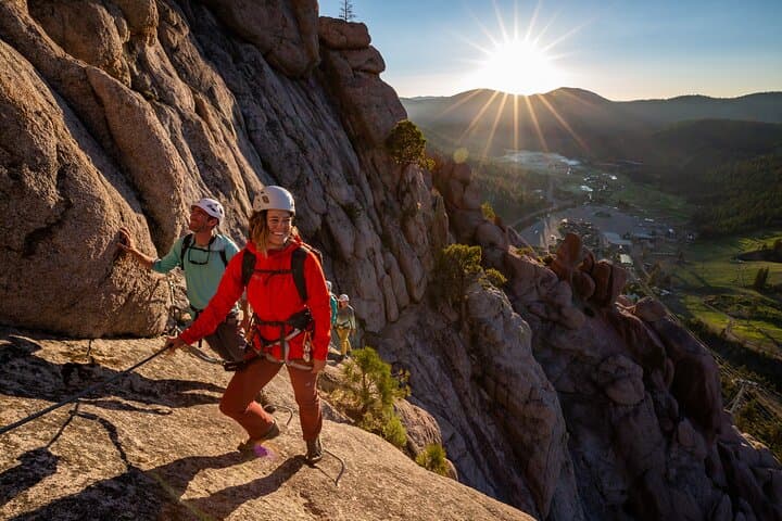 Our guide Syd, leading a group of happy climbers up the Via Ferrata as the sun rises over Lake Tahoe.